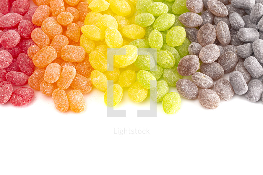 red, orange, brown, and green Old Fashioned Hard Candies Isolated on a White Background