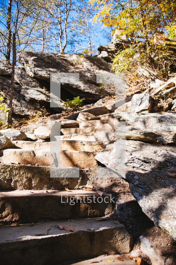 steps cut into rock along a trail 