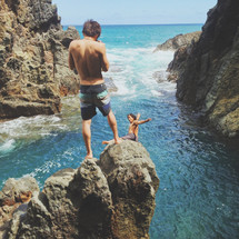 cliff diving into the ocean in Hawaii 