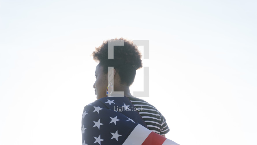 woman wrapped in an American flag 