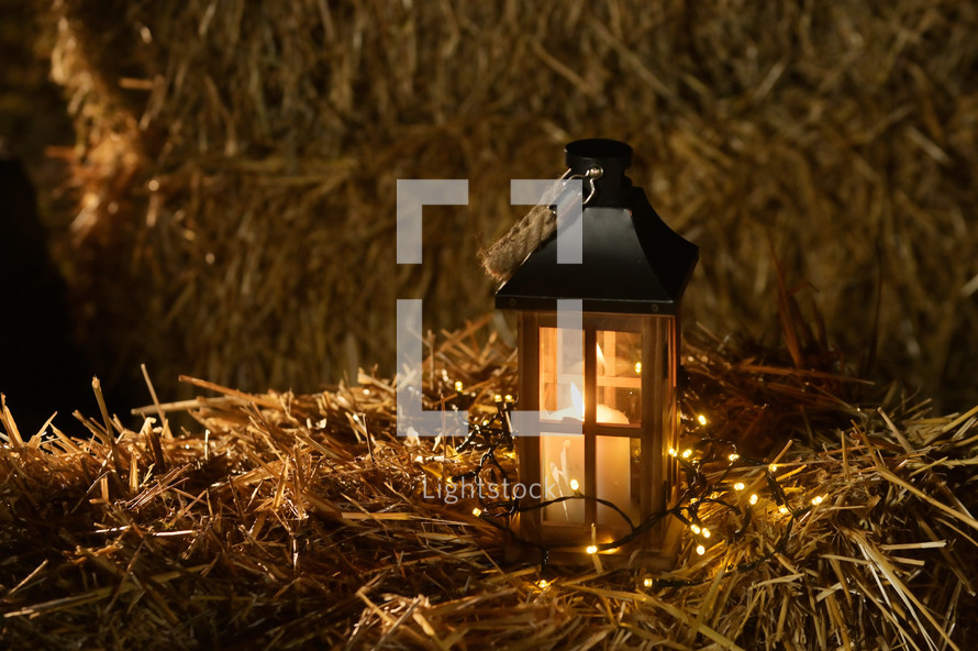lantern on a hay bale 