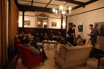 people gathered in a room for a Bible study 