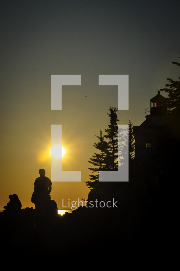 silhouettes of hikers at sunrise 