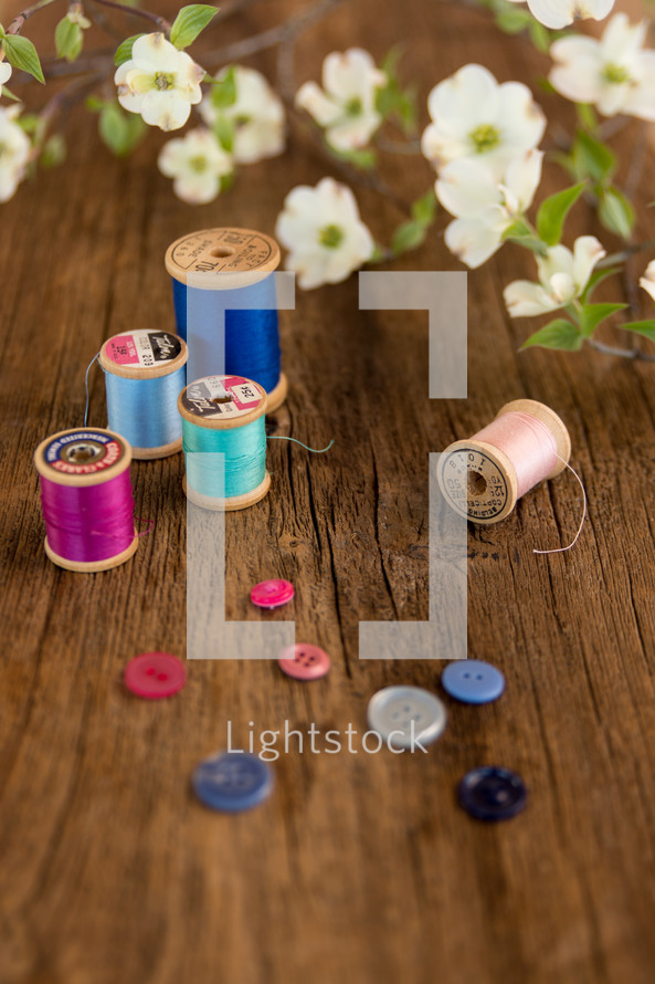 sewing supplies with white dogwood flowers 