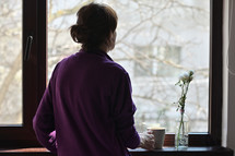 A Self-isolated Woman or Quarantine Looking Out Window Home