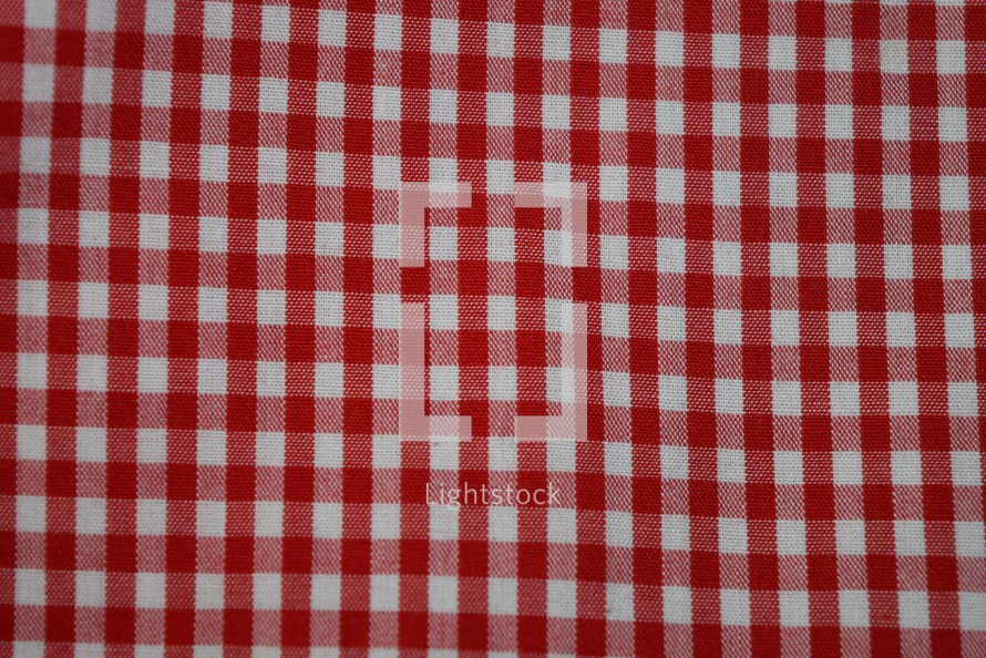 red and white gingham background, picnic blanket
