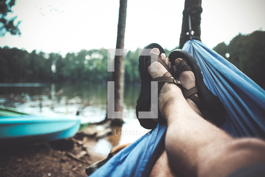 feet in sandals in a hammock 