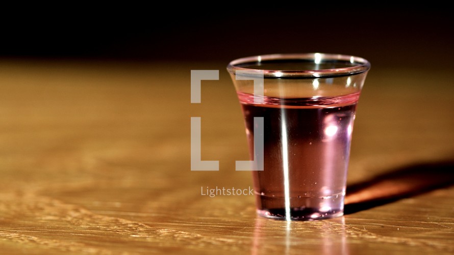 communion cup on wood background 
