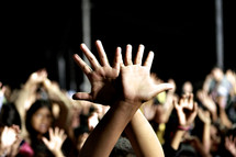 Hands raised during corporate worship