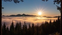 Colorful sunset in alps forest mountain landscape with foggy clouds motion fast in valley nature time-lapse
