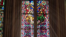 Radiant church stained glass scene from inside



