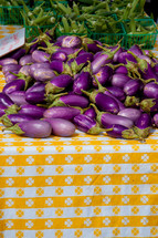 Eggplant and okra on a picnic table.