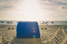 beach chairs and a tent 