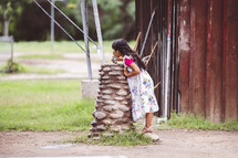 child drinking from a water fountain in Mexico 