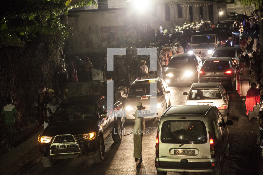 cars at night on a busy African street 