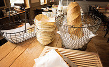 bread basket on a table in a restaurant 