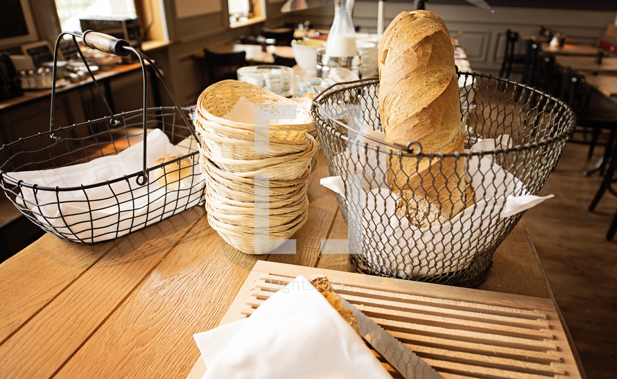 bread basket on a table in a restaurant 