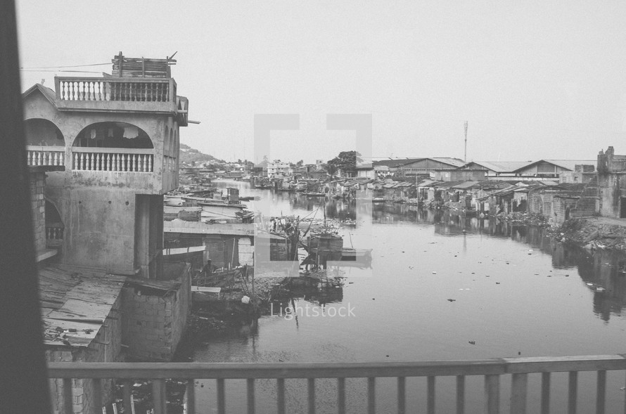 City along a canal as seen form a bridge.