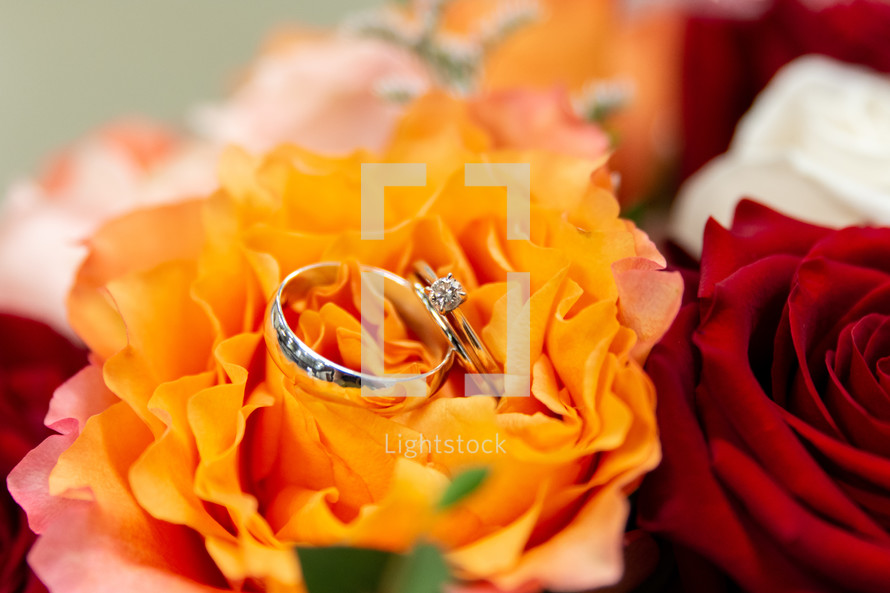 wedding rings on flower bouquet 
