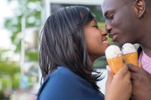 an African American couple eating ice cream 