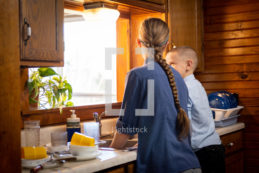 children doing dishes in the kitchen 