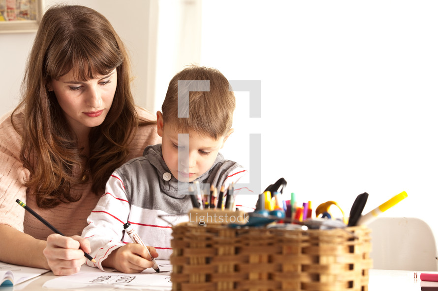 mother helping her son with homework