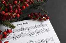 Christmas sheet music on black background 