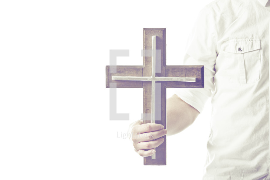 man holding a cross 