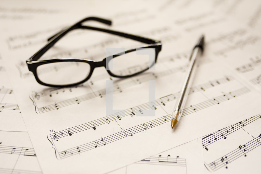 sheet music and reading glasses