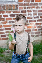 boy picking flowers 