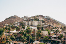 Hillside village of homes and marketplace in Cabo San Lucas.