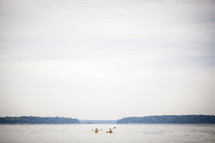 paddling kayaks on a lake 