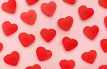 red hearts on a pink background 