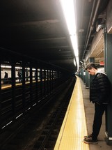 man waiting in the subway 