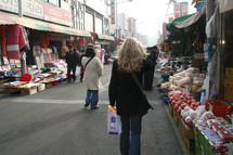 woman walking in a street market in Korea 