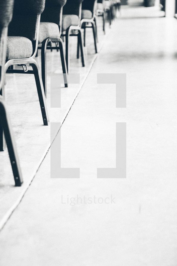 aisle floor beside of empty church chairs