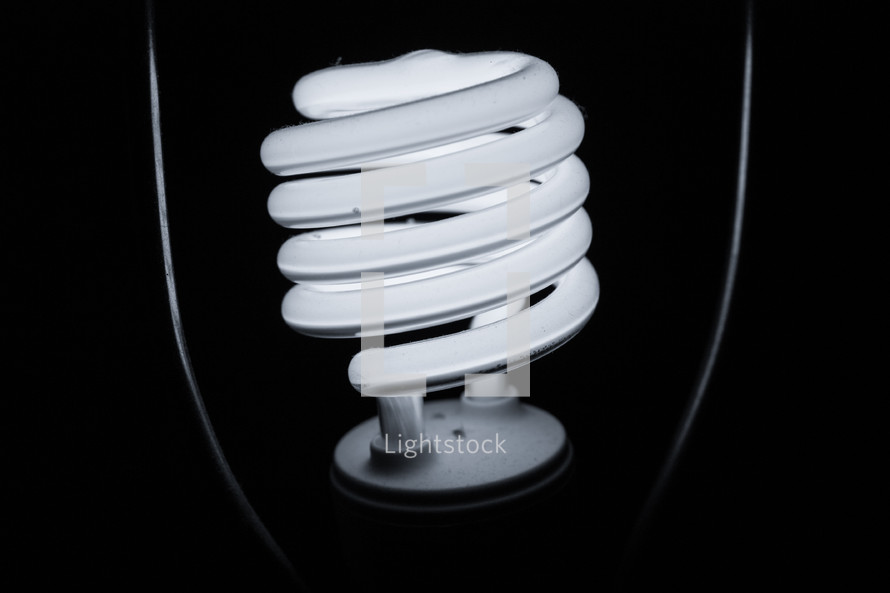 A close-up of an illuminated lightbulb