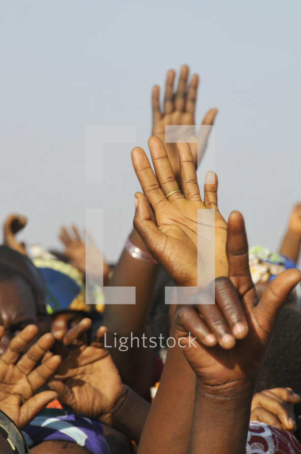 Nigerian hands raised - reaching out