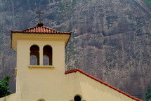 Church-top at the foot of a mountain