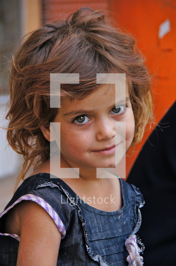 Eyes of an innocent Kurdish refugee girl child [For similar, search for Ethnic Smile Face] 