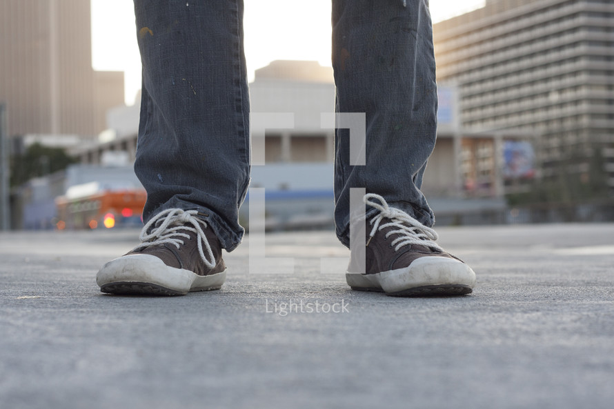 sneakers on a city sidewalk 