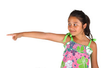 Little girl pointing with the finger on white background