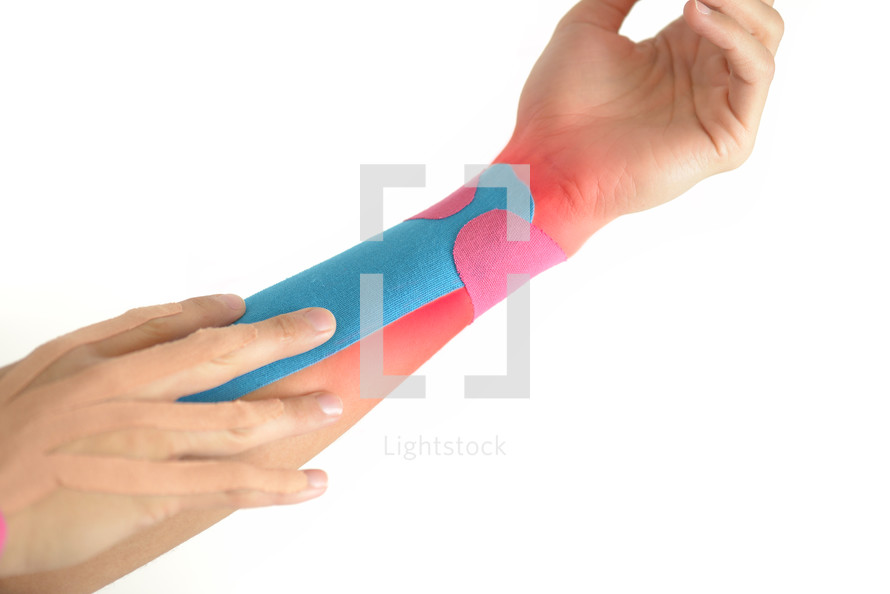 Kinesiology taping on woman hand with painful area highlighted in red, isolated on white backgrond