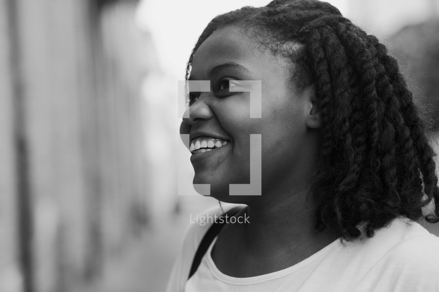 side profile of a smiling African American woman 