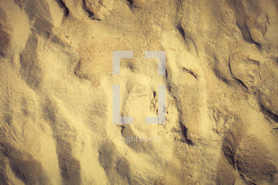 A fading footprint in the sand