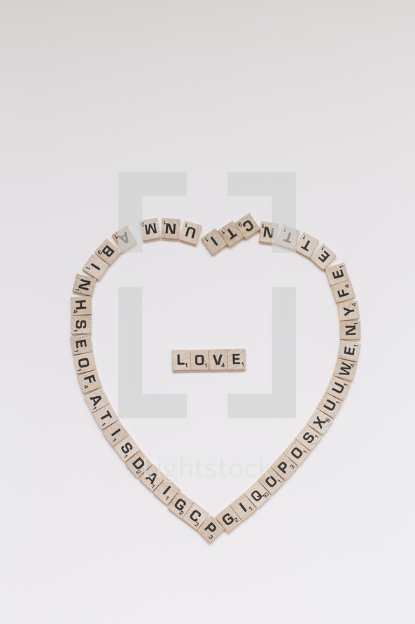 scrabble pieces in the shape of a heart 