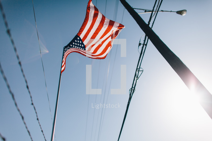 American flag and power lines 