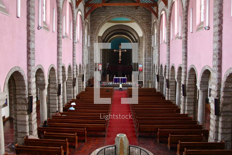 people praying inside a church 