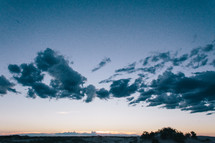 clouds above desert mountains 