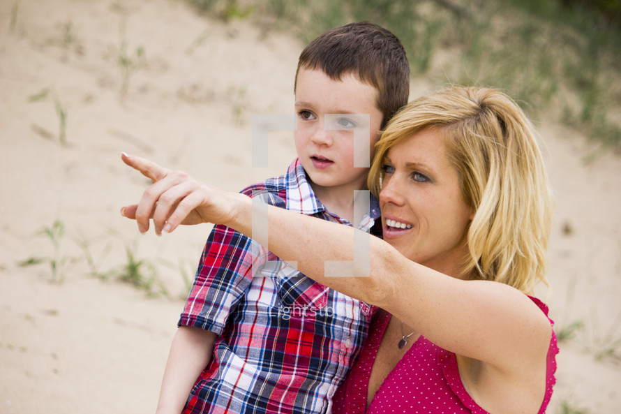 mother and son pointing 